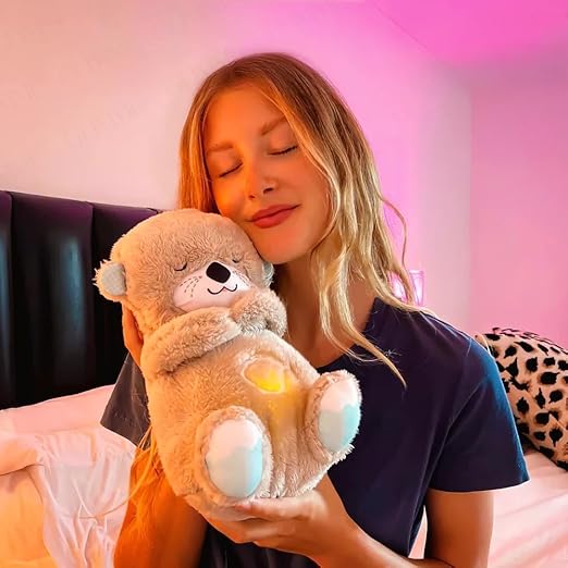 Collection of glowing teddy bears available in beige, blue, pink, and brown colors.